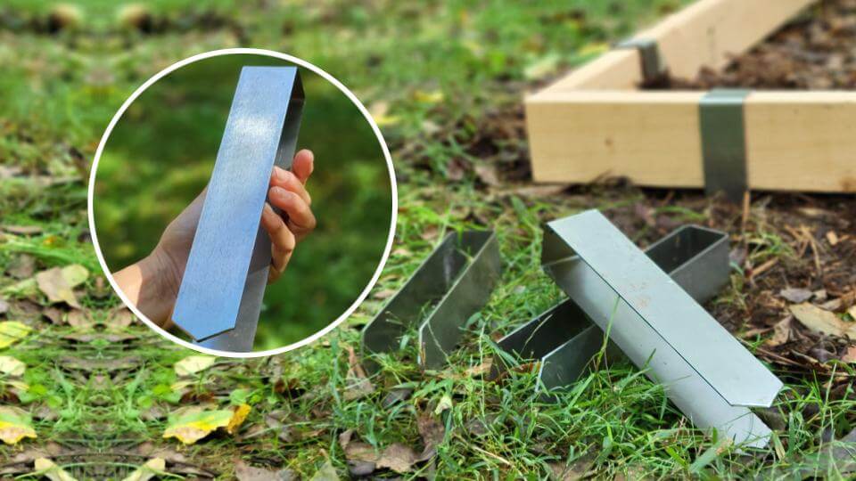 2xEDGE Rustic Steel Staples on grass with raised bed in background and inset of hand holding a 2xEDGE Staple in foreground