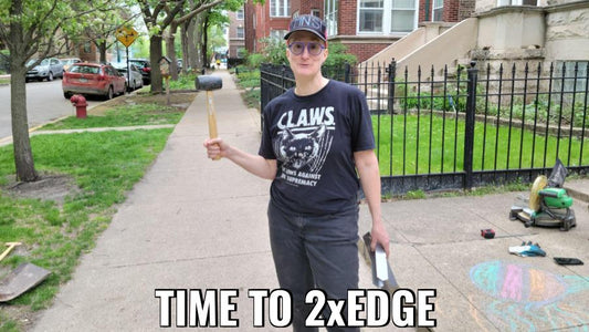 A woman standing on a city street with a rubber mallet in one hand and 2xEDGE Staples in the other.