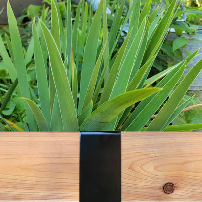 Satin Black 2xEDGE Staple installed on 2x4 lumber as wood garden edging