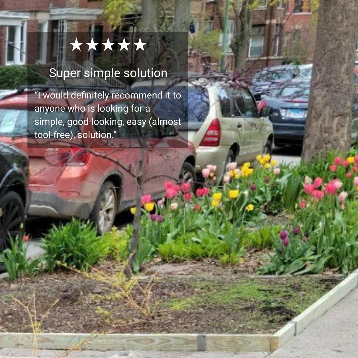 2x4 lumber curb edging along a tulip bed at the sidewalk's edge.